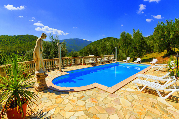 Pool set within Tuscan countryside